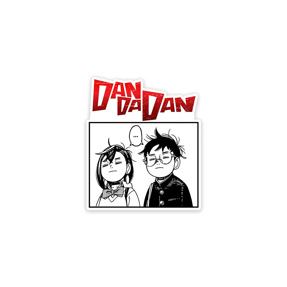 A rectangular sticker with a red background and a white horizontal stripe in the middle. In the center of the white stripe, black Devanagari text reads "घुमक्कड़" which translates to "Wanderer." The red background has faint travel-themed illustrations.