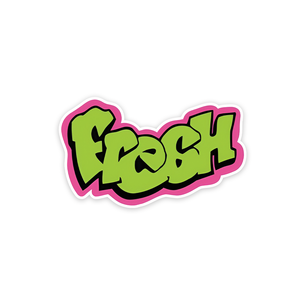 A rectangular sticker with a red background and a white horizontal stripe in the middle. In the center of the white stripe, black Devanagari text reads "घुमक्कड़" which translates to "Wanderer." The red background has faint travel-themed illustrations.