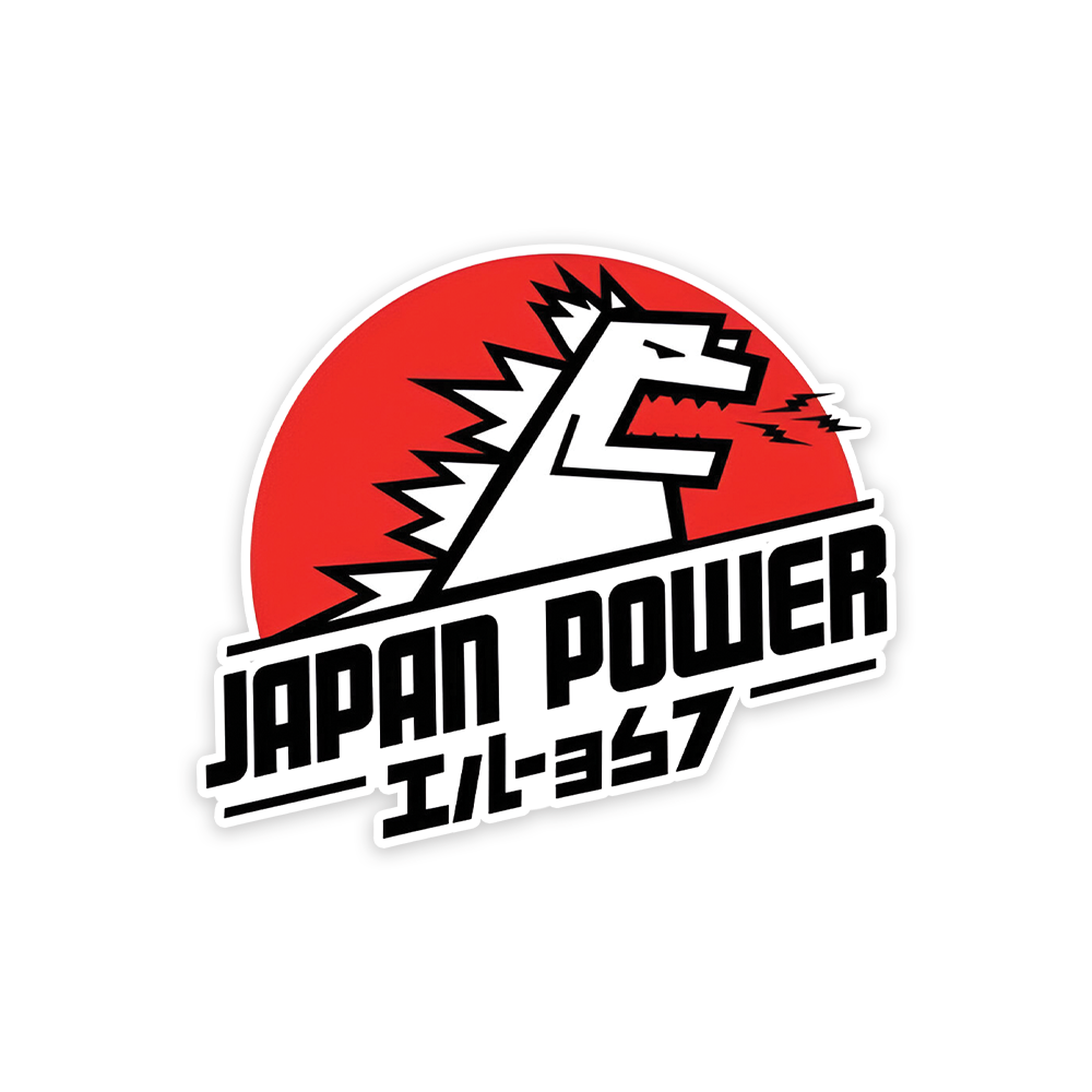 A rectangular sticker with a red background and a white horizontal stripe in the middle. In the center of the white stripe, black Devanagari text reads "घुमक्कड़" which translates to "Wanderer." The red background has faint travel-themed illustrations.