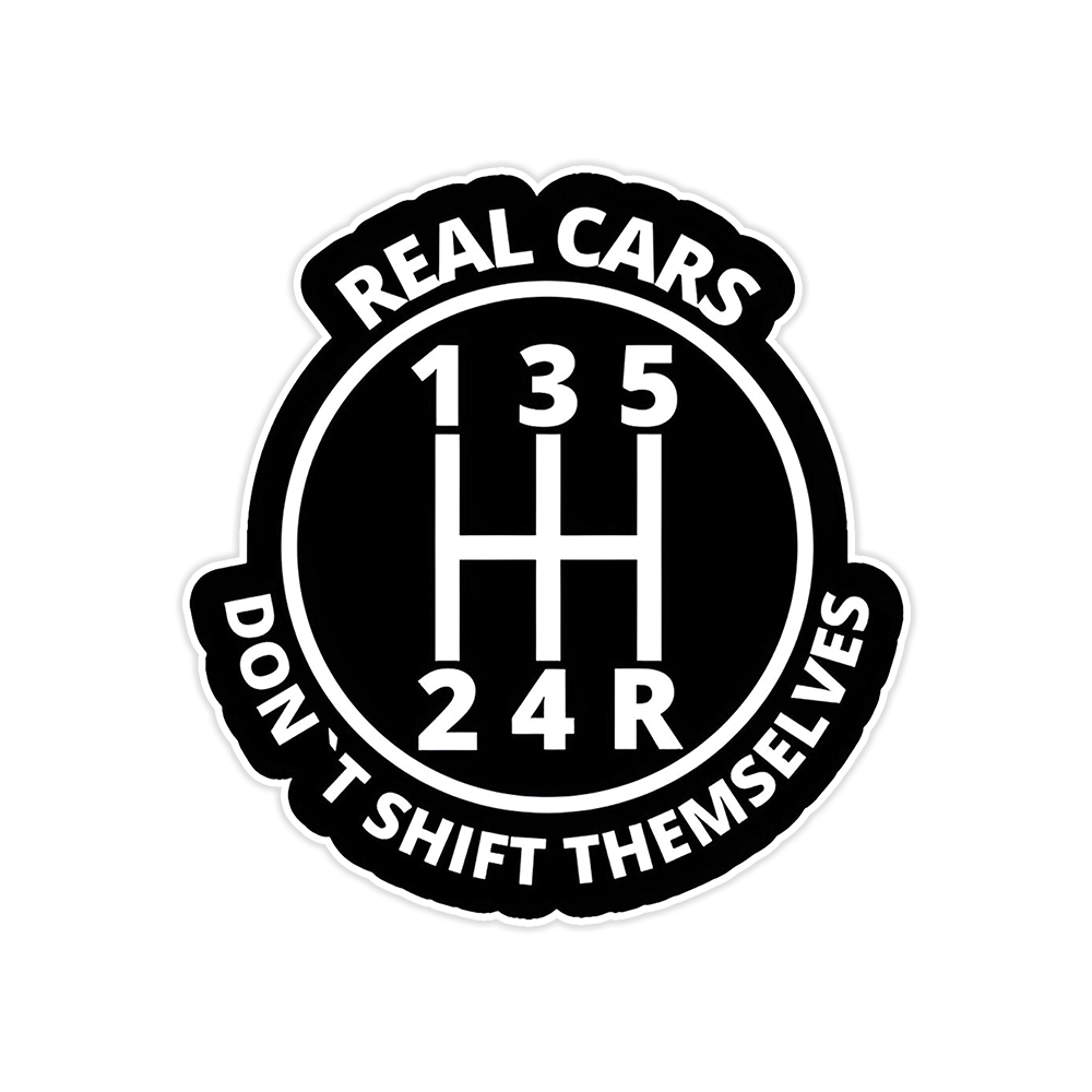 A rectangular sticker with a red background and a white horizontal stripe in the middle. In the center of the white stripe, black Devanagari text reads "घुमक्कड़" which translates to "Wanderer." The red background has faint travel-themed illustrations.