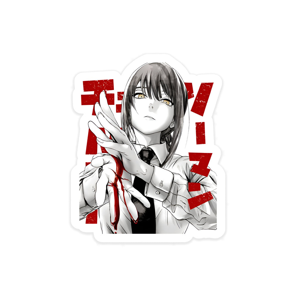 A rectangular sticker with a red background and a white horizontal stripe in the middle. In the center of the white stripe, black Devanagari text reads "घुमक्कड़" which translates to "Wanderer." The red background has faint travel-themed illustrations.