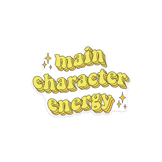 A rectangular sticker with a red background and a white horizontal stripe in the middle. In the center of the white stripe, black Devanagari text reads "घुमक्कड़" which translates to "Wanderer." The red background has faint travel-themed illustrations.