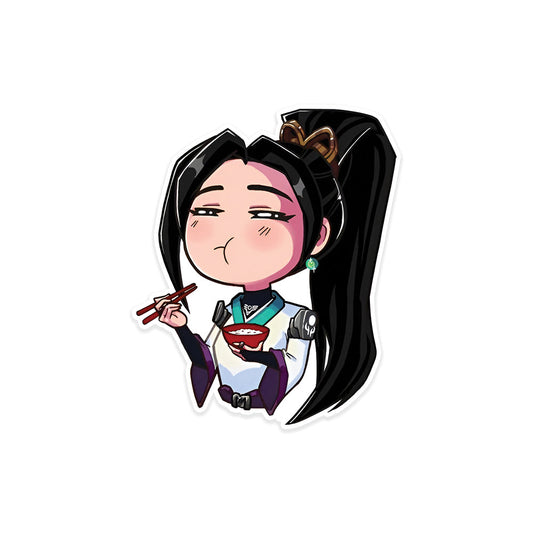 A rectangular sticker with a red background and a white horizontal stripe in the middle. In the center of the white stripe, black Devanagari text reads "घुमक्कड़" which translates to "Wanderer." The red background has faint travel-themed illustrations.