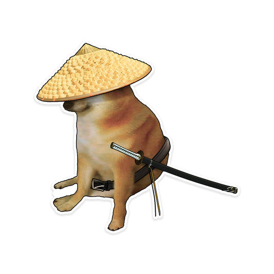 A rectangular sticker with a red background and a white horizontal stripe in the middle. In the center of the white stripe, black Devanagari text reads "घुमक्कड़" which translates to "Wanderer." The red background has faint travel-themed illustrations.