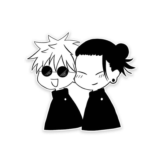 A rectangular sticker with a red background and a white horizontal stripe in the middle. In the center of the white stripe, black Devanagari text reads "घुमक्कड़" which translates to "Wanderer." The red background has faint travel-themed illustrations.