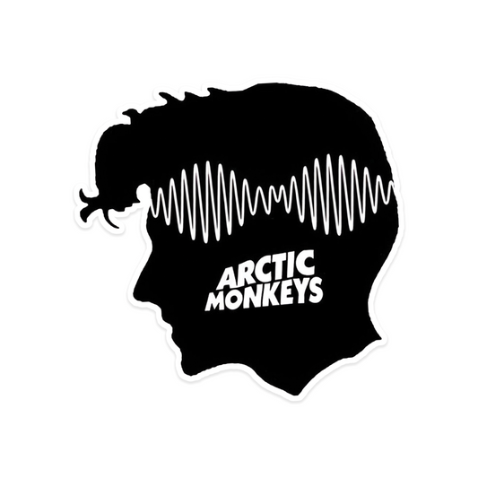 A rectangular sticker with a red background and a white horizontal stripe in the middle. In the center of the white stripe, black Devanagari text reads "घुमक्कड़" which translates to "Wanderer." The red background has faint travel-themed illustrations.